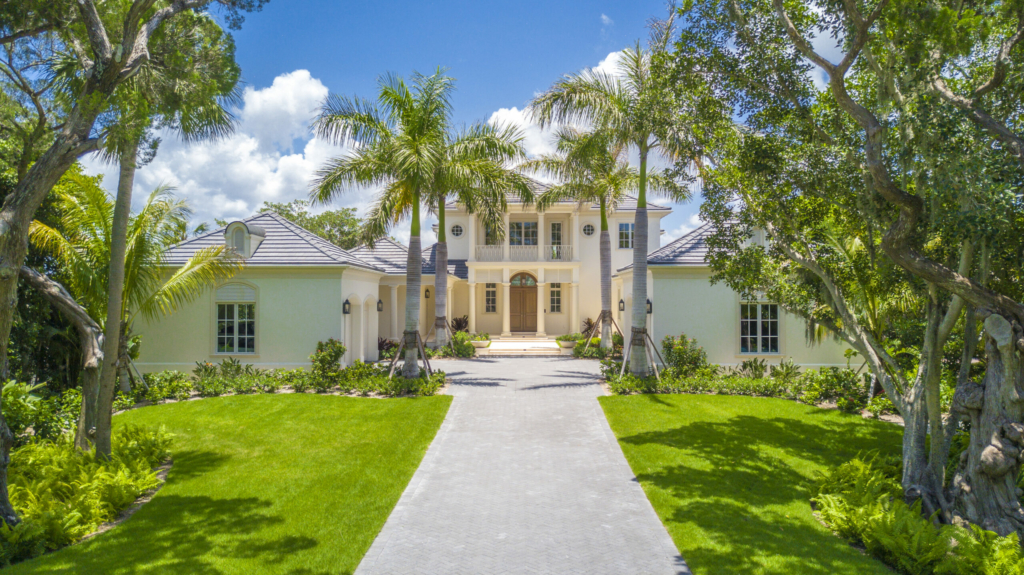 luxury spec building brought to completion. Image of the house front lawn and door